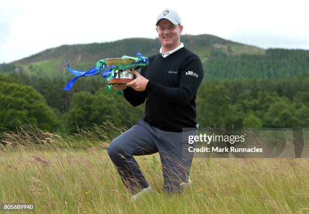 Richard McEvoy of England poses with the trophy after winning the 2017 SSE Scottish Hydro Challenge hosted by MacDonald Hotels and Resorts at Spey...