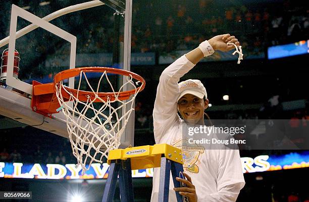 Candace Parker of the Tennessee Lady Volunteers celebrates cutting down the net after their 64-48 win against the Stanford Cardinal during the...