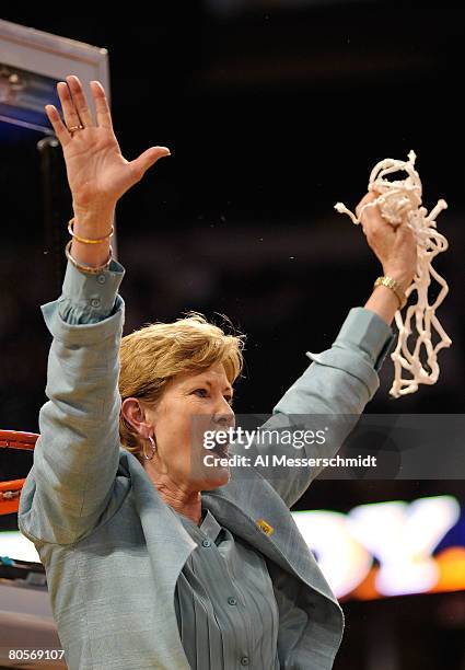 Head coach Pat Summitt of the Tennessee Lady Volunteers celebrates cutting down the net after their 64-48 win against the Stanford Cardinal during...