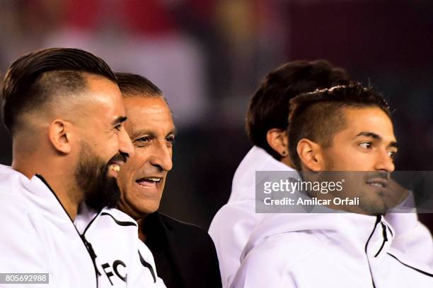 Former coach and player of River Plate Ramon Diaz laughs with Ariel Rojas and Manuel Lanzini during Fernando Cavenaghi's farewell match at Monumental...