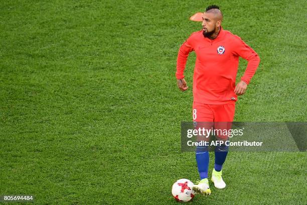 Chile's midfielder Arturo Vidal warms up before the 2017 Confederations Cup final football match between Chile and Germany at the Saint Petersburg...