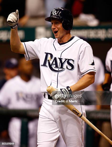 Outfielder Elliot Johnson of the Tampa Bay Rays congratulates his teammate, Shawn Riggans after a homerun against the Seattle Mariners during the...