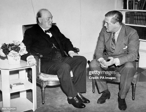 Sir Winston Churchill chats with his son Randolph Churchill