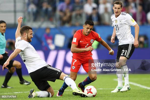 Shkodran Mustafi of Germany tackles Alexis Sanchez of Chile during the FIFA Confederations Cup Russia 2017 Final between Chile and Germany at Saint...