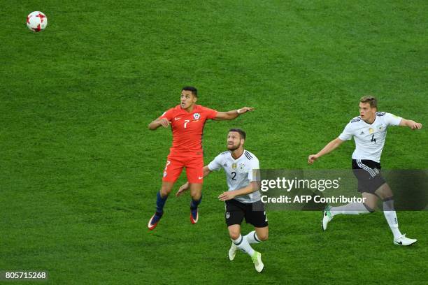 Chile's forward Alexis Sanchez jumps for the ball against Germany's defender Shkodran Mustafi during the 2017 Confederations Cup final football match...