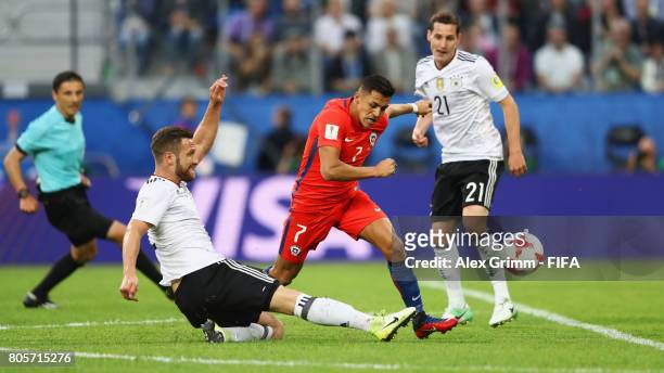 Shkodran Mustafi of Germany tackles Alexis Sanchez of Chile during the FIFA Confederations Cup Russia 2017 Final between Chile and Germany at Saint...