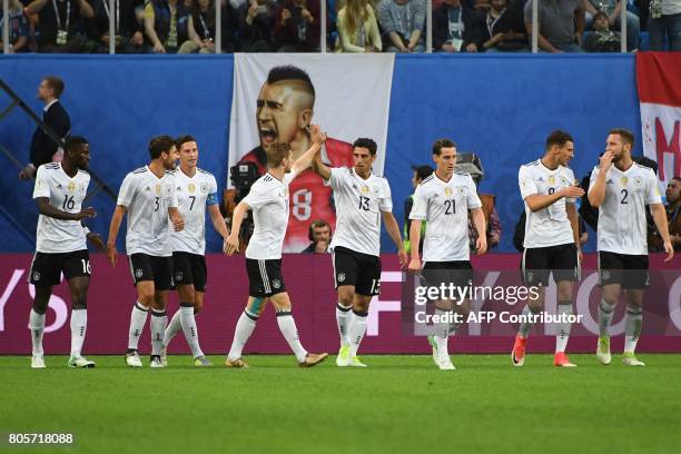 Germany's midfielder Lars Stindl celebrates with team mates after scoring the first goal during the 2017 Confederations Cup final football match...