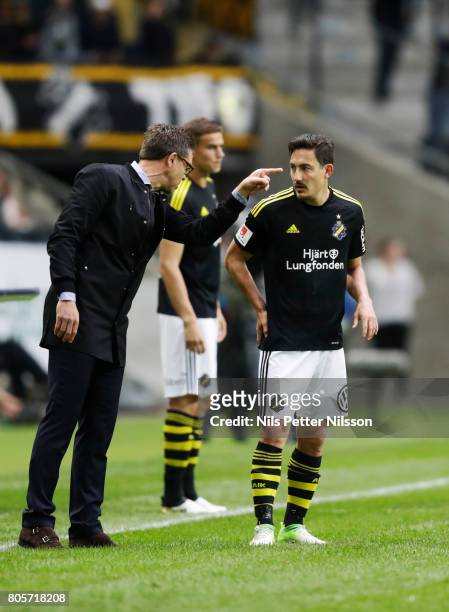 Rikard Norling, head coach of AIK in discussion with Stefan Ishizaki of AIK during the Allsvenskan match between AIK and Ostersunds FK at Friends...