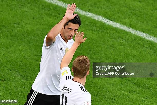 Germany's midfielder Lars Stindl celebrates with team mates after scoring the first goal during the 2017 Confederations Cup final football match...