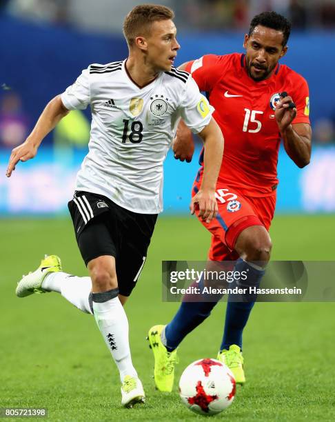 Joshua Kimmich of Germany and Jean Beausejour of Chile battle for possession during the FIFA Confederations Cup Russia 2017 Final between Chile and...