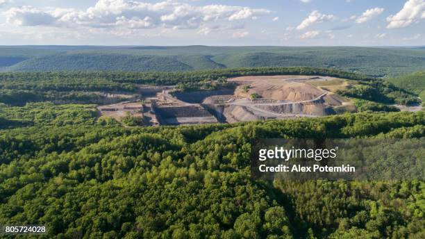 the aerial view to the open-cast mine in lehigh valley, carbon county, pennsylvania, usa. - open pit mine stock pictures, royalty-free photos & images