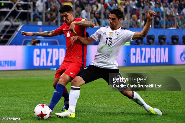 Lars Stindl of Germany tackles Pablo Hernandez of Chile during the FIFA Confederations Cup Russia 2017 Final match between Chile and Germany at Saint...