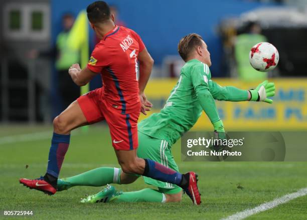 Marc-Andre Ter Stegen of the Germany national football team and Alexis Sanchez of the Chile national football team vie for the ball during the 2017...