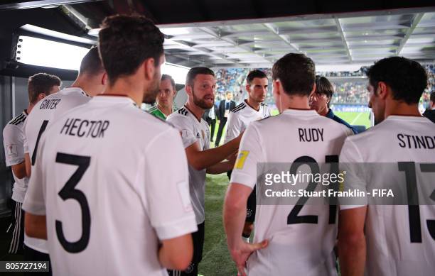 Shkodran Mustafi of Germany speaks to his team mates in the tunnel at half time during the FIFA Confederations Cup Russia 2017 Final between Chile...