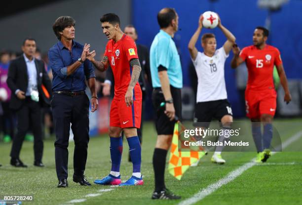 Joachim Loew, coach of Germany and Pablo Hernandez of Chile argue during the FIFA Confederations Cup Russia 2017 Final between Chile and Germany at...