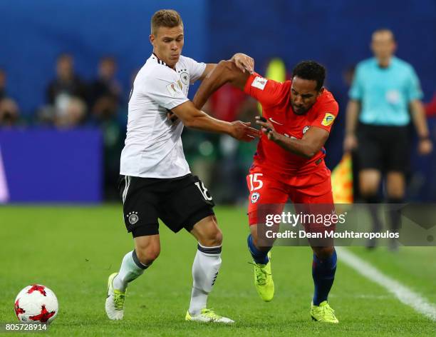 Joshua Kimmich of Germany and Jean Beausejour of Chile battle for possession during the FIFA Confederations Cup Russia 2017 Final between Chile and...
