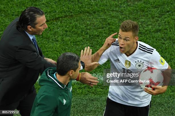 Chile's Spanish coach Juan Antonio Pizzi reacts to Germany's defender Joshua Kimmich gesturing during the 2017 Confederations Cup final football...