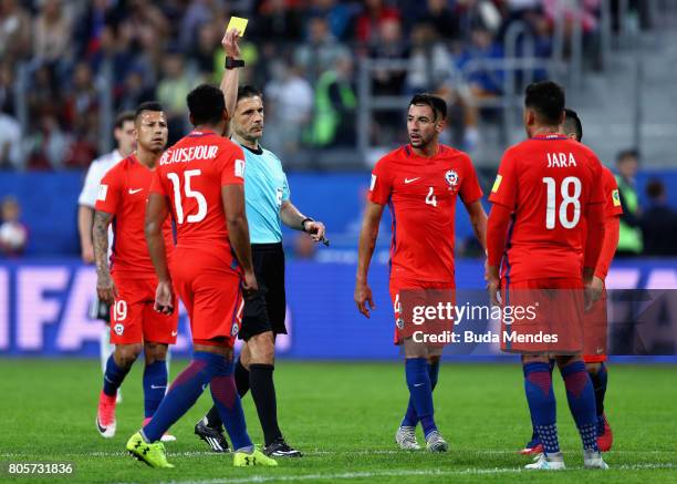 Gonzalo Jara of Chile is shown a yellow card by Referee Milorad Mazic during the FIFA Confederations Cup Russia 2017 Final between Chile and Germany...