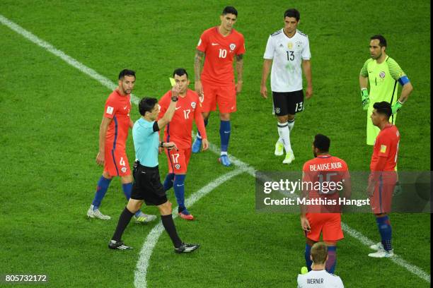 Gonzalo Jara of Chile is shown a yellow card by Referee Milorad Mazic during the FIFA Confederations Cup Russia 2017 Final between Chile and Germany...