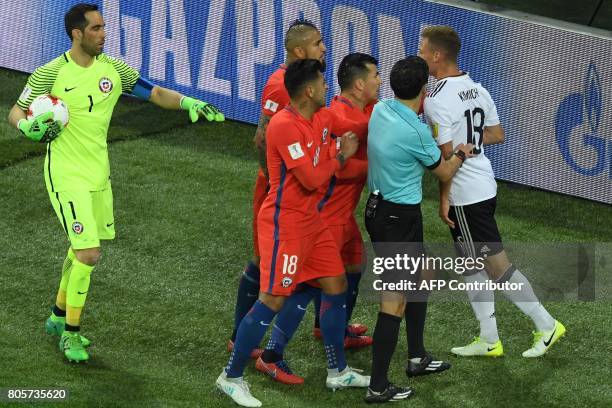Chile's defender Gonzalo Jara and Chile's defender Gary Medel react as Chile's midfielder Arturo Vidal and Germany's defender Joshua Kimmich argue...