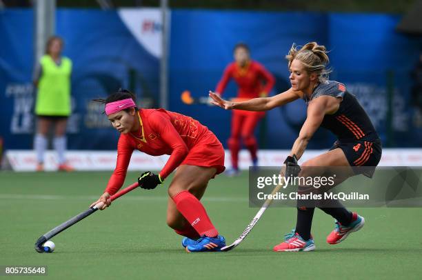 Kitty van Male of Netherlands and Qiuxia Cui of China during the final of the Fintro Hockey World League Semi-Final tournament between the...