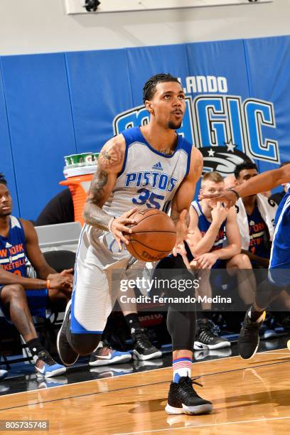 Michael Gbinije of the Detroit Pistons handles the ball against the New York Knicks during the 2017 Summer League on July 2, 2017 at Amway Center in...