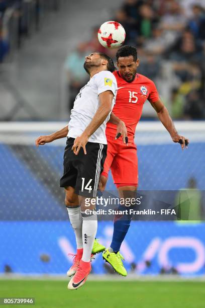 Emre Can of Germany and Jean Beausejour of Chile attempt to win a header during the FIFA Confederations Cup Russia 2017 Final between Chile and...