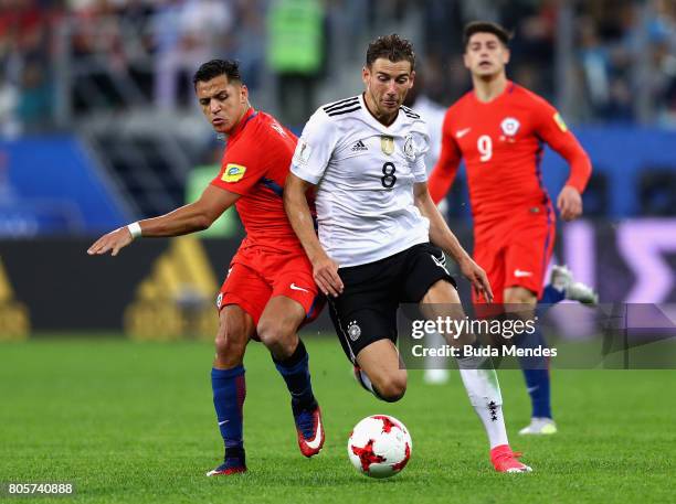 Alexis Sanchez of Chile and Leon Goretzka of Germany battle for possession during the FIFA Confederations Cup Russia 2017 Final between Chile and...