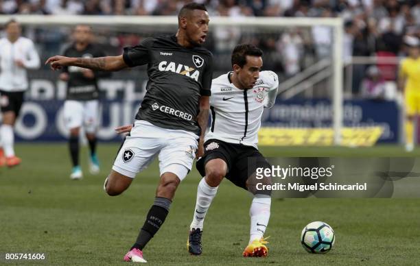 Jadson of Corinthians vies for the ball with Gilson of Botafogo during the match between Corinthians and Botafogo for the Brasileirao Series A 2017...