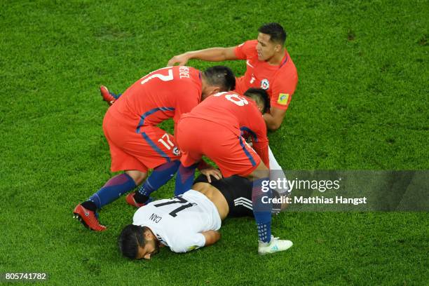 Gonzalo Jara of Chile and Gary Medel of Chile attempt to grab the ball from Emre Can of Germany legs during the FIFA Confederations Cup Russia 2017...