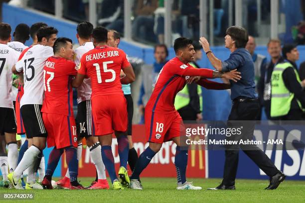 Germany Head Coach / Manager Joachim Low clashes on the pitch with Gonzalo Jara of Chile during the FIFA Confederations Cup Russia 2017 Final match...