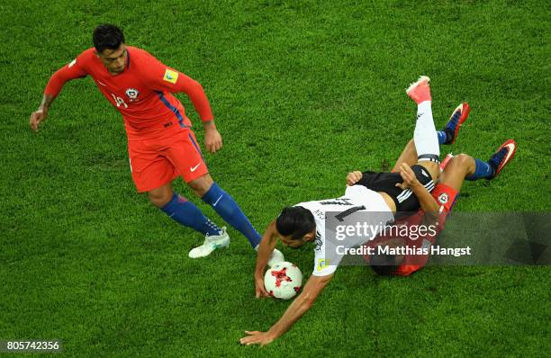 Emre Can of Germany is fouled by Alexis Sanchez of Chile as Gonzalo Jara of Chile looks on during the FIFA Confederations Cup Russia 2017 Final...