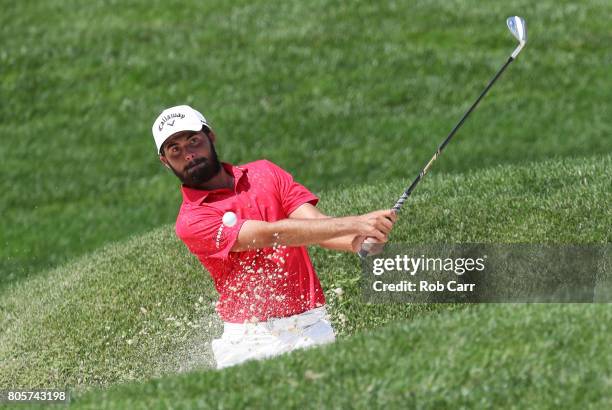 Curtis Luck of Australia plays a shot from a bunker on the eighth hole during the final round of the Quicken Loans National on July 2, 2017 TPC...