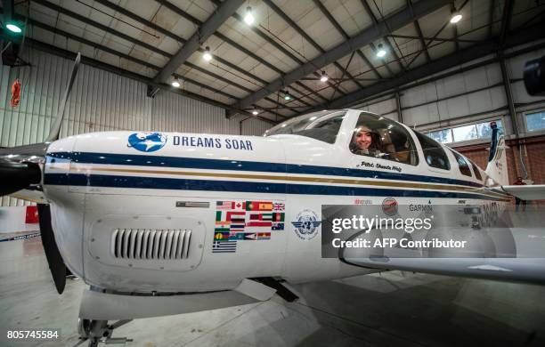 Shaesta Waiz, Afghanistans first female certified civilian pilot, poses for a picture from inside her plane in a hangar at Cairo International...