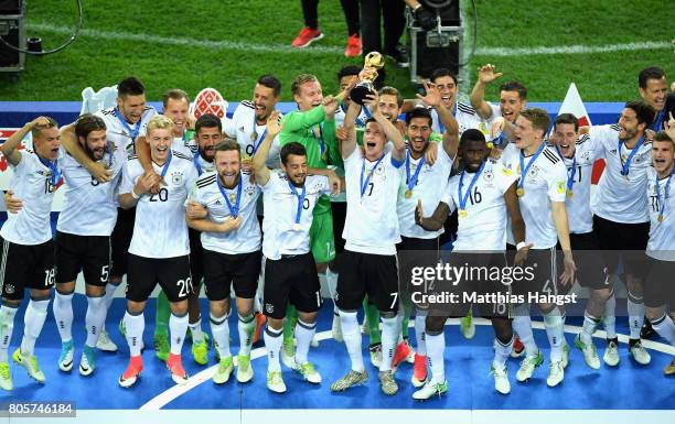 Julian Draxler of Germany lifts the FIFA Confederations Cup trophy after the FIFA Confederations Cup Russia 2017 Final between Chile and Germany at...