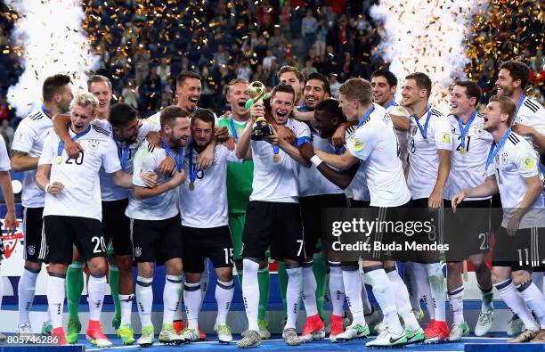 Julian Draxler of Germany lifts the FIFA Confederations Cup trophy after the FIFA Confederations Cup Russia 2017 Final between Chile and Germany at...