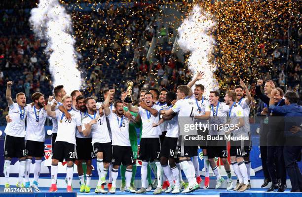 Julian Draxler of Germany lifts the FIFA Confederations Cup trophy after the FIFA Confederations Cup Russia 2017 Final between Chile and Germany at...