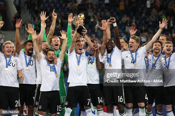 Julian Draxler of Germany lifts the trophy with his team-mates at the end of the FIFA Confederations Cup Russia 2017 Final match between Chile and...