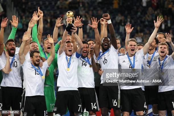 Julian Draxler of Germany lifts the trophy with his team-mates at the end of the FIFA Confederations Cup Russia 2017 Final match between Chile and...