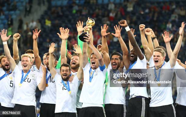 Julian Draxler of Germany lifts the FIFA Confederations Cup trophy after the FIFA Confederations Cup Russia 2017 Final between Chile and Germany at...