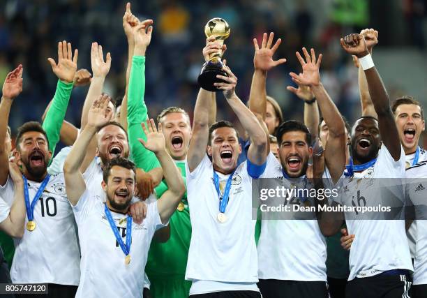 Julian Draxler of Germany lifts the FIFA Confederations Cup trophy after the FIFA Confederations Cup Russia 2017 Final between Chile and Germany at...