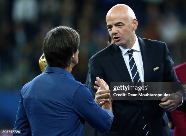 Joachim Loew, head coach of Germany shakes hands with FIFA President Ganni Infantino at the award ceremony after the FIFA Confederations Cup Russia...