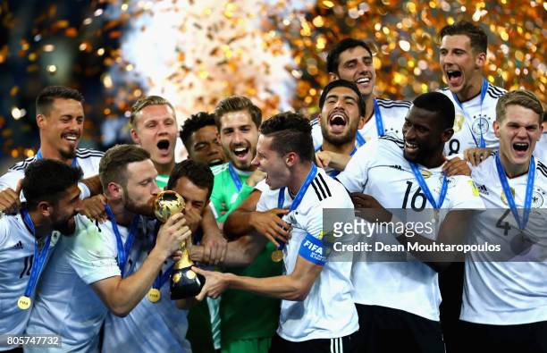 Shkodran Mustafi of Germany and Julian Draxler of Germany kiss the trophy after the FIFA Confederations Cup Russia 2017 Final between Chile and...