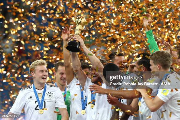 Shkodran Mustafi of Germany lifts the trophy with his team-mates at the end of the FIFA Confederations Cup Russia 2017 Final match between Chile and...