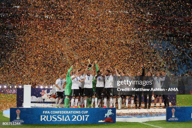 Shkodran Mustafi of Germany lifts the trophy with his team-mates at the end of the FIFA Confederations Cup Russia 2017 Final match between Chile and...