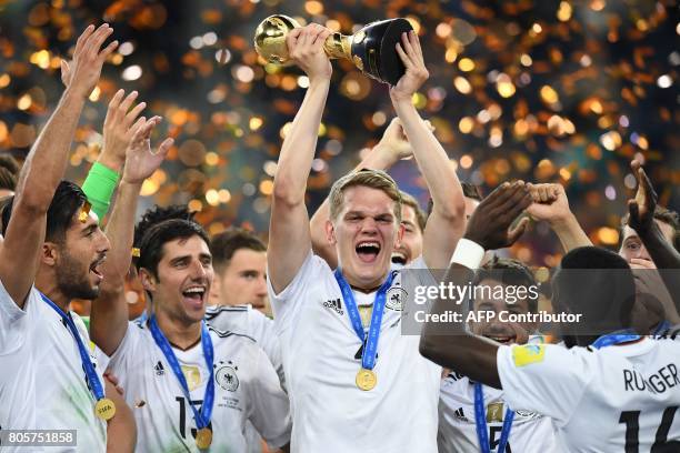 Germany's defender Matthias Ginter lifts the trophy after winning the 2017 Confederations Cup final football match between Chile and Germany at the...