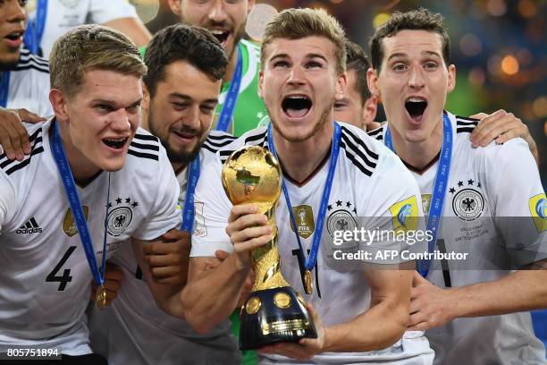 Germany's forward Timo Werner lifts the trophy after winning the 2017 Confederations Cup final football match between Chile and Germany at the Saint...