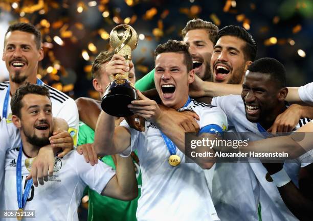 Julian Draxler of Germany lifts the FIFA Confederations Cup trophy after the FIFA Confederations Cup Russia 2017 Final between Chile and Germany at...