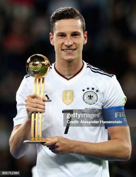 Julian Draxler of Germany poses with the golden ball award after the FIFA Confederations Cup Russia 2017 Final between Chile and Germany at Saint...