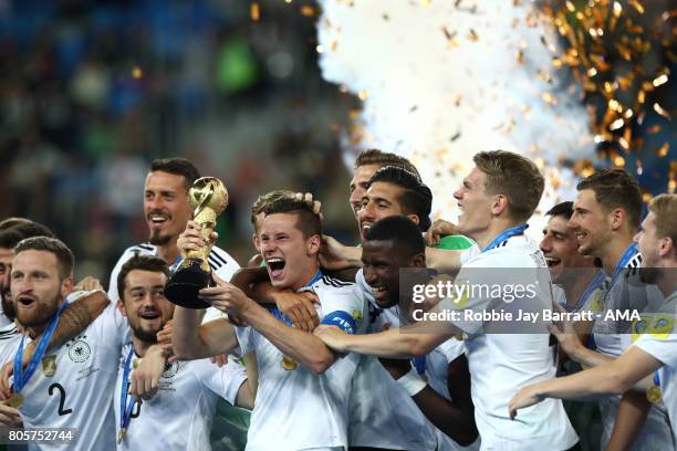 Julian Draxler of Germany lifts the trophy with his team-mates at the end of the FIFA Confederations Cup Russia 2017 Final match between Chile and...